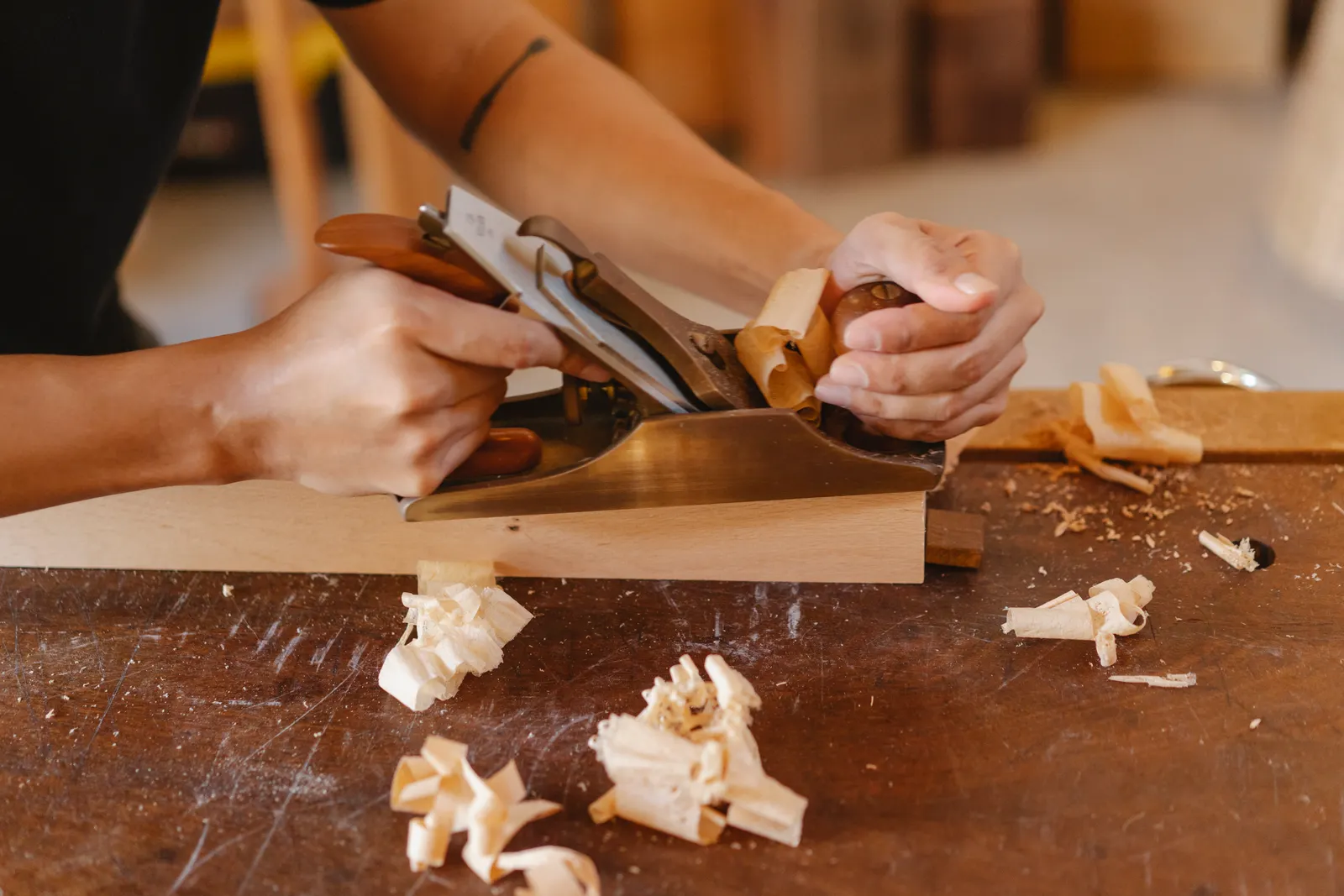 Hand-planing a piece of wood
