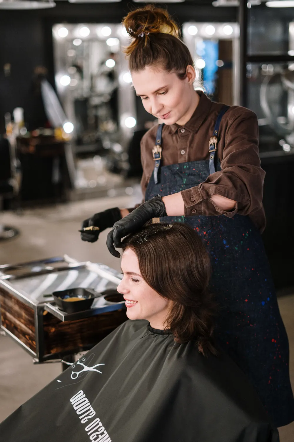 Stylist applying color in the salon
